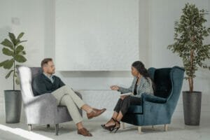 A psychologist talking to her patient